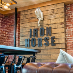 Book Iron Horse, a 2-bedroom downtown Hot Springs condo above Deluca's Pizza with gas fireplace, private balcony, and shuffleboard.
