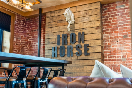 Book Iron Horse, a 2-bedroom downtown Hot Springs condo above Deluca's Pizza with gas fireplace, private balcony, and shuffleboard.