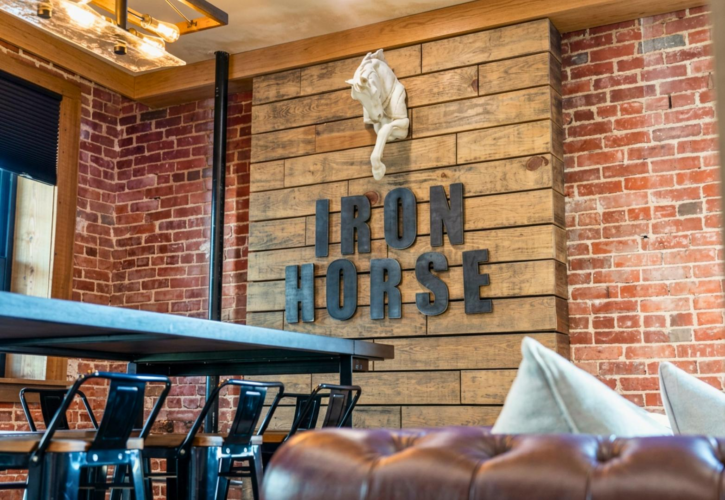Book Iron Horse, a 2-bedroom downtown Hot Springs condo above Deluca's Pizza with gas fireplace, private balcony, and shuffleboard.