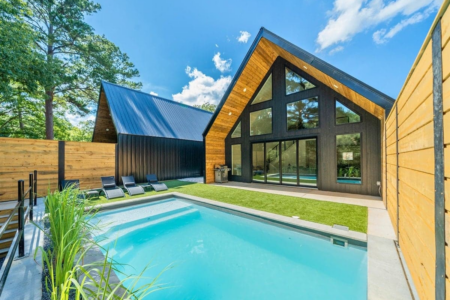 Ruth House Micro Resort in Hot Springs, AR! Features an A-frame layout with private pool, fire pit, kayaks, mini-golf, and mountain views.