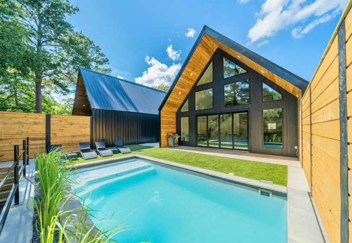Ruth House Micro Resort in Hot Springs, AR! Features an A-frame layout with private pool, fire pit, kayaks, mini-golf, and mountain views.